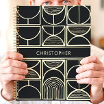 Modern Black and Gold Minimalist Planner<br><div class="desc">This sleek and modern design features a bold black background with an intricate geometric pattern in metallic gold. Clean lines and minimalist shapes create a stylish, sophisticated look, while the custom name in the center adds a personal touch. Ideal for professionals, students, or anyone who appreciates contemporary and elegant aesthetics....</div>