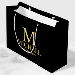 Modern Black and Gold Personalized Groomsman Large Gift Bag<br><div class="desc">Modern Personalized Groomsman Gifts featuring personalized monogram, groomsman's name and title in gold classic serif font style on black background. Also perfect for best man, father of the bride, ring bearer and more. Please Note: The foil details are simulated in the artwork. No actual foil will be used in the...</div>