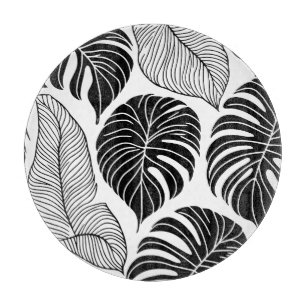 Modern black and white tropical leaves cutting board