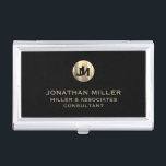 Modern Black Brushed Metallic Gold Monogram Business Card Case<br><div class="desc">Elevate your professional look with this stylish and practical business card case. Featuring a brushed monogram medallion with your name company and title in classic block typography, this case is a great way to keep your business cards organized and protected. The black background adds a touch of sophistication, while the...</div>