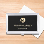 Modern Black Brushed Metallic Gold Monogram Business Card Case<br><div class="desc">Elevate your professional look with this stylish and practical business card case. Featuring a brushed monogram medallion with your name company and title in classic block typography, this case is a great way to keep your business cards organized and protected. The black background adds a touch of sophistication, while the...</div>