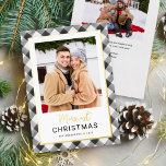 Modern Black Buffalo Plaid Christmas Photo Foil Holiday Card<br><div class="desc">Modern and festive plaid photo holiday card features a favorite vertical photo framed by a border and accents of real gold foil and hand painted watercolor black and white buffalo plaid check patterned background. Personalize the custom "Merriest Christmas" text with your preferred wording, family name, and the year. The back...</div>