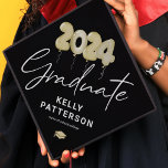 Modern Black Gold Balloons 2024 Graduation Cap Topper<br><div class="desc">Modern graduation cap topper featuring a trendy black background that can be changed to any color,  watercolor gold 2024 balloons,  their name,  and the high school or college they attended.</div>