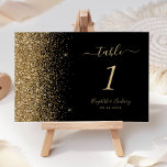 Modern Black Gold Glitter Edge Wedding Table Number<br><div class="desc">The left-hand edge of this elegant modern wedding table number features a gold faux glitter design. The customizable text combines pale gold colored handwriting,  copperplate and italic fonts on a black background.</div>