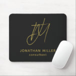 Modern Black Gold Monogram Mouse Pad<br><div class="desc">Keep your workspace stylish and functional with this Modern Black Gold Monogram Mouse Pad. The sleek design features a customizable monogram with name and title on a black background, and the non-slip rubber base ensures a secure grip on any surface. Perfect for both personal and professional use, this mouse pad...</div>