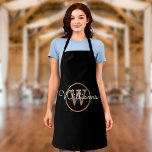 Modern Black Gold Monogram Script Name Apron<br><div class="desc">Modern stylish black and gold script name monogram apron. You can personalize the name and monogram initial to create your own unique design. Designed by Thisisnotme©</div>