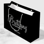 Modern Black Personalized Bridesmaids Large Gift Bag<br><div class="desc">Modern Personalized Bridesmaids Gifts
featuring personalized bridesmaid's name in white modern calligraphy font style with title and wedding date in white modern sans serif font style on black background.

Also perfect for Maid of Honor,  Flower Girl,  Mother of the Bride and more.</div>