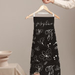 Modern Black White Floral lineart personalized Apron<br><div class="desc">Elevate your kitchen style with this Modern Black White Floral Line Art Personalized Apron. Featuring a sleek, minimalist black and white floral line art design, this apron brings elegance and sophistication to any cooking or baking experience. Customize with your name, making it the perfect personalized gift for bakers, chefs, or...</div>