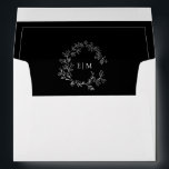 Modern Black White Leafy Crest Monogram Wedding Envelope<br><div class="desc">Our Modern Black White Leafy Crest Monogram Wedding Envelope is the perfect way to add a touch of elegance and modernity to your wedding stationary. This simple, yet chic envelope features a hand drawn leafy wreath encircling a modern wedding monogram. It's perfect for the stylish bride who wants to add...</div>