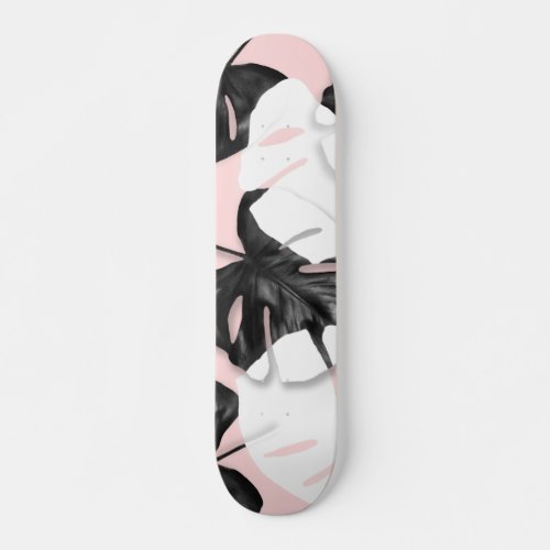 Modern black white tropical monstera leaf on pink skateboard