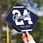 Modern Blue Masculine 2024 Graduation Cap Topper<br><div class="desc">Masculine graduation cap topper featuring a blue background that can be changed to fit your personal taste or match your school colors, with a bold white "24" emblazoned in the center, representing the class year and symbolizing the start of a new chapter in life. Plus sleek lines running across the...</div>