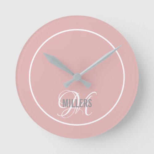 Modern blush pink script monogram family name  round clock