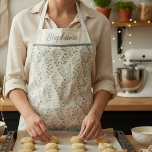 Modern Boho Floral Pattern Sage Cream Apron<br><div class="desc">Personalize with name,  initials or a message. This elegant minimalist design features delicate sage green floral silhouettes set against a neutral cream background. The refined botanical pattern blends modern simplicity with a soft boho charm,  creating a timeless and versatile aesthetic. Perfect for those who love understated elegance.</div>