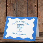 Modern Bold Wavy Border Personalized Blue Hanukkah Card<br><div class="desc">Send your warmest Hanukkah wishes with these elegant, customizable greeting cards. Featuring a vibrant blue background, a classic menorah illustration, and a wavy border design, these cards offer a modern twist on traditional Hanukkah themes. Personalize with your family name for a truly special touch, making each card a memorable keepsake...</div>