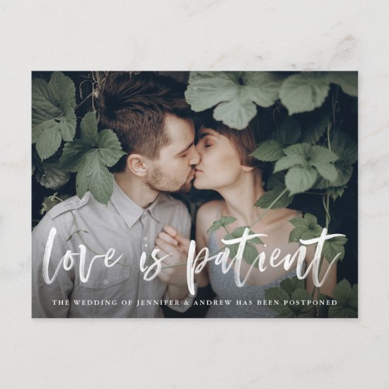 Modern Brush Script Love is Patient Postponement Announcement Postcard