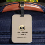 Modern Brushed Gold Monogram Beige Luggage Tag<br><div class="desc">A modern luxury vertical design in classic style with a brushed metallic gold monogram emblem with large typographic initial monogram on a neutral beige background. The text can easily be customized using the fields provided.</div>