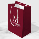 Modern Burgundy Red Personalized Groomsman Medium Gift Bag<br><div class="desc">Modern Burgundy Red Personalized Groomsman Gifts
featuring personalized monogram,  groomsman's name and title in white classic serif font style on burgundy red background.

Also perfect for Best Man,  Father of the Bride and more.</div>