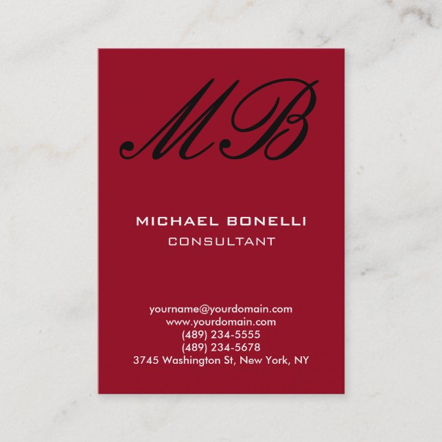 Modern carmine red script monogram business card (Front)