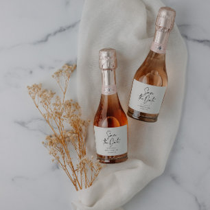 Modern casual script black save the date wedding sparkling wine label