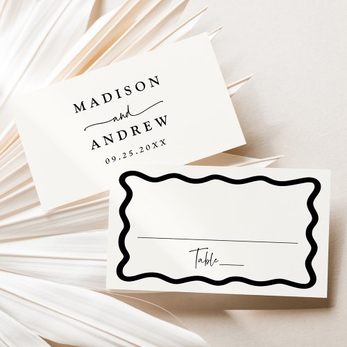 Modern Cream and Black Wavy Frame Wedding Place Card