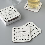 Modern Cream and Black Wavy Frame Wedding Square Paper Coaster<br><div class="desc">Add a stylish touch to your wedding reception, rehearsal dinner, engagement party, or wedding shower with these Modern Cream and Black Wavy Frame paper coasters. The retro wedding coasters display the couple's names in bold black lettering surrounded by a black wavy border contrasting with a light cream background. The trendy...</div>
