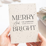 Modern Cream Merry and Bright Non-Photo Holiday Card<br><div class="desc">Modern holiday card featuring "Merry and Bright" displayed in black lettering and cream background with subtle black dots (snow). Personalize the front of the non-photo holiday card with your family name and the year in black lettering. The card reverses to display your personal message in black lettering or leave it...</div>