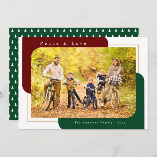 Modern Curved Photo Green Peace and Love Holiday Card - This Christmas photo card features a modern design offering a horizontal photo frame with two curved corners. This same modern shape appears in the background in a dark red and dark green.  The greeting reads: "Peace and love".