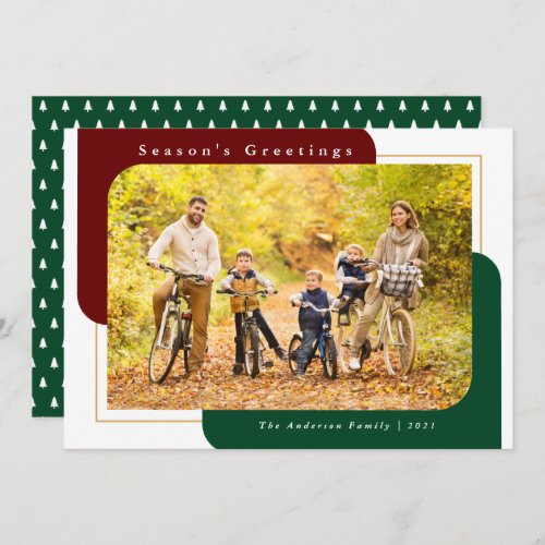 Modern Curved Photo Green Season's Greetings Holiday Card - This Christmas photo card features a modern design offering a horizontal photo frame with two curved corners. This same modern shape appears in the background in a dark red and dark green.  The greeting reads: "Season's Greetings".