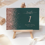 Modern Dark Green Rose Gold Glitter Wedding Table Number<br><div class="desc">The left-hand edge of this elegant modern wedding table number features a rose gold faux glitter design. The customizable text combines rose pink handwriting,  copperplate and italic fonts on a dark green background.</div>