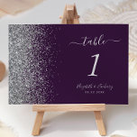 Modern Dark Purple Silver Glitter Edge Wedding Table Number<br><div class="desc">The left-hand edge of this elegant modern wedding table number features a silver faux glitter design. The customizable text combines silver gray handwriting,  copperplate and italic fonts on a dark purple background.</div>