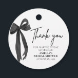 Modern Elegant Black Bow Thank you Bridal Shower Favor Tags<br><div class="desc">Say thank you in style with our Modern Elegant Black Bow Bridal Shower Favor Tags. Designed with a sleek black ribbon bow and minimalist typography, these tags add a sophisticated touch to your party favors. Perfect for black and white bridal showers, bachelorette parties, or coquette-themed events. Easily edit the text...</div>