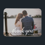 Modern Elegant Script Thank You Photo Wedding Magnet<br><div class="desc">Modern photo wedding favor magnet featuring "thank you" in an elegant typography script with swashes along with your names and wedding date in white over your favorite horizontal picture.  These custom magnets make useful wedding favors and are great for any style of wedding.</div>