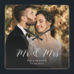 Modern Elegant Script Wedding Photo Newlywed Chic  Square Wall Clock<br><div class="desc">This elegant script custom photo wall clock will be a beautiful keepsake of your wedding day! The unique calligraphy reads 'Mr and Mrs' alongside your personal family name. Add your favorite wedding photo and make this into a perfect gift for newlyweds,  an anniversary,  or vow renewal!</div>