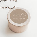 Modern Elegant Taupe Wedding Thank You Classic Round Sticker<br><div class="desc">Elegant wedding stickers displaying "Thank You" in a beautiful white calligraphy script with a taupe background or color of your choice. Personalize the modern thank you stickers with your names and wedding date. The taupe wedding thank you stickers are perfect to use for sealing thank you card envelopes, wedding favor...</div>