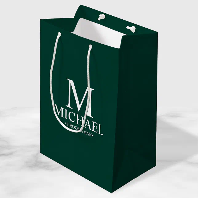 Emerald green groomsman gift bag with white custom text.