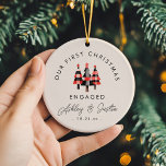 Modern Engagement First Christmas Cozy Plaid  Ceramic Ornament<br><div class="desc">Celebrate your first Christmas engaged with our cozy plaid trees ornament! This modern ceramic design brings warm holiday vibes to your tree. Personalize with custom text for a special,  unique touch!</div>
