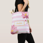 Modern Gold Floral Pink Lotus Bridesmaid Tote Bag<br><div class="desc">Add a modern and luxurious touch to your special day with this exquisite Pink Lotus Tote Bag. Designed with an elegant floral pattern against a vibrant pink backdrop, this tote bag not only serves as a functional piece but also a stunning fashion accessory. The bag is thoughtfully designed with a...</div>