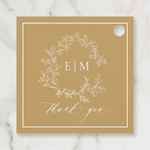 Modern Gold Leafy Crest Monogram Wedding Favor Tag - send your guest home with a thank you gift adorned with this trendy favor tag! We're loving this trendy, modern gold wedding design! Simple, elegant, and oh-so-pretty, it features a hand drawn leafy wreath encircling a modern wedding monogram. It is personalized in elegant typography, and accented with hand-lettered calligraphy. Finally, it is trimmed in a delicate frame. Veiw suite here: https://www.zazzle.com/collections/gold_leafy_crest_monogram_wedding-119668631605460589 Contact designer for matching products to complete the suite, OR for color variations of this design. Thank you sooo much for supporting our small business, we really appreciate it! 
We are so happy you love this design as much as we do, and would love to invite
you to be part of our new private Facebook group Wedding Planning Tips for Busy Brides. 
Join to receive the latest on sales, new releases and more! 
https://www.facebook.com/groups/622298402544171  
Copyright Anastasia Surridge for Elegant Invites, all rights reserved.
