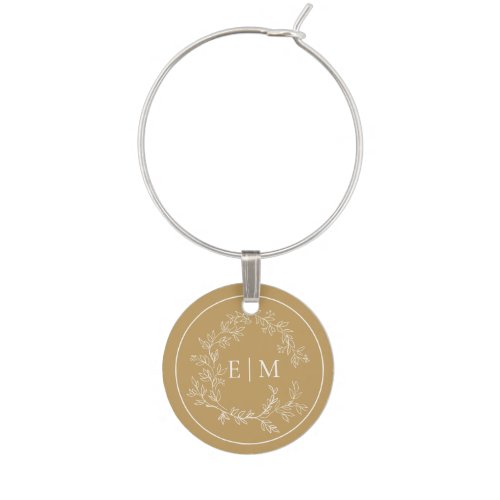 Modern Gold Leafy Crest Monogram Wedding Wine Char Wine Charm - A unique wedding wine charm! We're loving this trendy, modern gold wedding design! Simple, elegant, and oh-so-pretty, it features a hand drawn leafy wreath encircling a modern wedding monogram. It is personalized in elegant typography, and accented with hand-lettered calligraphy. Finally, it is trimmed in a delicate frame. Veiw suite here: https://www.zazzle.com/collections/gold_leafy_crest_monogram_wedding-119668631605460589 Contact designer for matching products to complete the suite, OR for color variations of this design. Thank you sooo much for supporting our small business, we really appreciate it! 
We are so happy you love this design as much as we do, and would love to invite
you to be part of our new private Facebook group Wedding Planning Tips for Busy Brides. 
Join to receive the latest on sales, new releases and more! 
https://www.facebook.com/groups/622298402544171  
Copyright Anastasia Surridge for Elegant Invites, all rights reserved.