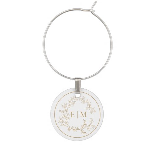 Modern Gold Leafy Crest Monogram Wedding Wine Charm - A unique wedding wine charm! We're loving this trendy, modern gold wedding design! Simple, elegant, and oh-so-pretty, it features a hand drawn leafy wreath encircling a modern wedding monogram. It is personalized in elegant typography, and accented with hand-lettered calligraphy. Finally, it is trimmed in a delicate frame. Veiw suite here: https://www.zazzle.com/collections/gold_leafy_crest_monogram_wedding-119668631605460589 Contact designer for matching products to complete the suite, OR for color variations of this design. Thank you sooo much for supporting our small business, we really appreciate it! 
We are so happy you love this design as much as we do, and would love to invite
you to be part of our new private Facebook group Wedding Planning Tips for Busy Brides. 
Join to receive the latest on sales, new releases and more! 
https://www.facebook.com/groups/622298402544171  
Copyright Anastasia Surridge for Elegant Invites, all rights reserved.