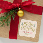 Modern Gold Script Merry Christmas Custom Square Sticker<br><div class="desc">Stylish Merry Christmas holiday favor sticker features antique gold script writing and accents of green branches with holly leaves and red berries. Personalize with custom name / family and year text. The beige background color can be modified.</div>