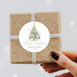 Modern Gold Script Watercolor Christmas Tree  Classic Round Sticker<br><div class="desc">Elegant,  Modern Gold Script Watercolor Christmas Tree Christmas Family Classic Round Sticker. Featuring a pretty hand lettered script Calligraphy with saying "merry christmas",  family name and year. Great for Christmas holiday season,  easy to personalize them with your names and year info.</div>