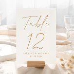 Modern Gold Script Wedding Table Number Card<br><div class="desc">Simple, modern wedding table number cards featuring "Table" displayed in a handwritten gold script with a white background (or a color of your choosing). To order the gold wedding table cards: add your name, wedding date, and table number. Each number needs to be added to your cart individually. After you...</div>
