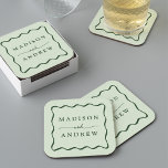 Modern Green Wavy Frame Wedding Square Paper Coaster<br><div class="desc">Add a stylish touch to your wedding reception, rehearsal dinner, engagement party, or wedding shower with these Modern Green Wavy Frame paper coasters. The retro wedding coasters display the couple's names in bold green lettering surrounded by a green wavy border contrasting with a light green background. The trendy wedding coasters...</div>