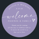 Modern Lavender Wedding Welcome Hotel Bag Classic Round Sticker<br><div class="desc">Lavender Hotel Bag Stickers: Welcome friends and family to your special weekend with these elegant lavender wedding stickers featuring a modern handwritten script. Each 3-inch round sticker displays the phrase “welcome friends & family, ” along with the couple’s names and wedding date below. The soft lavender background adds a romantic,...</div>