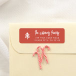 Modern Minimal Christmas Tree Family Name Red Label<br><div class="desc">A simple return address label, perfect for all your seasonal mail. The label is a boho red color, with a white Christmas tree on one side, and your family name and contact details on the other. Your name is written in modern script lettering, and your return address is printed in...</div>