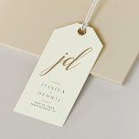 Modern Minimal Elegant Script Monogram Wedding Gift Tags<br><div class="desc">Modern Minimal Elegant Calligraphy Script Monogram Wedding Gift Tags Add a touch of elegance to your wedding favors with these stunning, modern, minimalist, and elegant calligraphy script monogram gift tags. Crafted in classic ivory, Storm Dust and gold, these tags are the perfect way to personalize your gifts and thank your...</div>