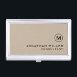 Modern Minimal Monogram Beige Business Card Case<br><div class="desc">Modern minimalist design with simple beige and black monogram medallion with personalized name and title or custom text below in classic block typography on a solid beige background. Personalize for your custom use.</div>