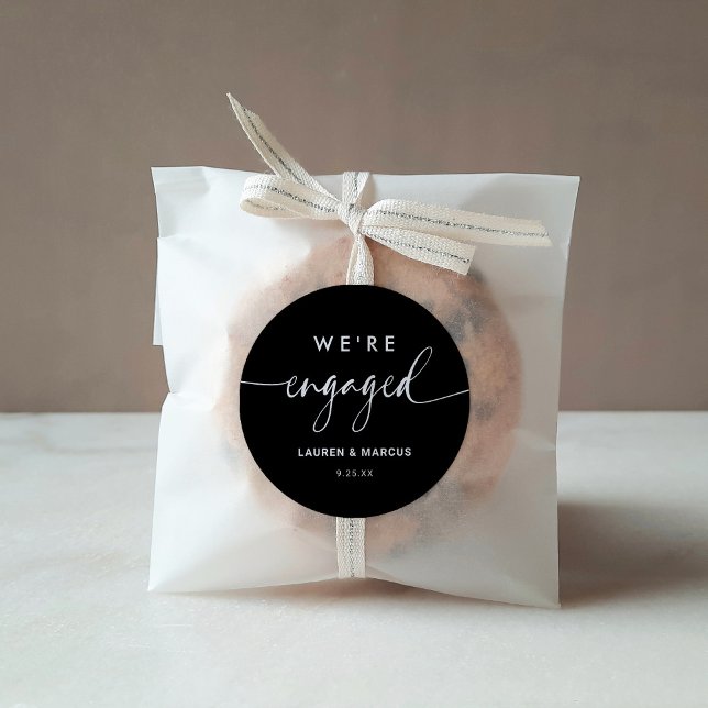 Modern Minimalist Black Calligraphy We're Engaged  Classic Round Sticker (Creator Uploaded)
