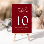 Modern Minimalist Burgundy Wedding Table Number<br><div class="desc">Elegant wedding table number card displaying the word "Table" in a white handwritten script with the table number, your names, and wedding date shown below with a burgundy background. The design repeats on the back. To order the table number cards, simply type each number and add it to your cart....</div>